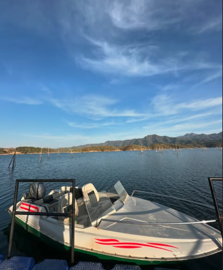 Small Boat Ride speedboat docked at sunset on the lake